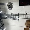 Steel caged walk through fixed access ladder